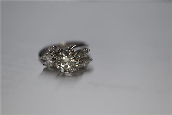 An 18ct white metal and single stone diamond ring, with marquise cut diamond set shoulders, size H/I.